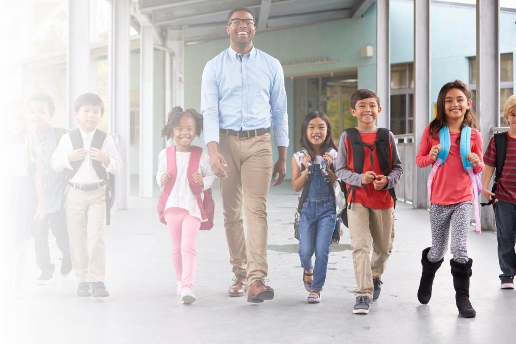 teacher walking with students